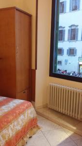 Voodi või voodid majutusasutuse Hotel Lorena toas