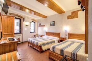 Voodi või voodid majutusasutuse Hotel Lorena toas