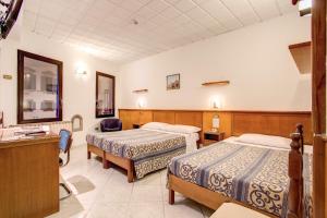 Voodi või voodid majutusasutuse Hotel Lorena toas