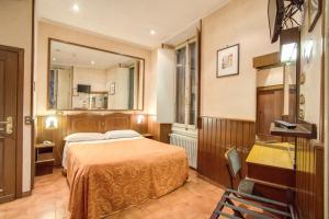 Postel nebo postele na pokoji v ubytování Hotel Lorena