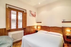 Voodi või voodid majutusasutuse Hotel Lorena toas