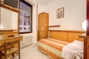 Voodi või voodid majutusasutuse Hotel Lorena toas