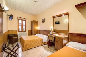 Voodi või voodid majutusasutuse Hotel Lorena toas