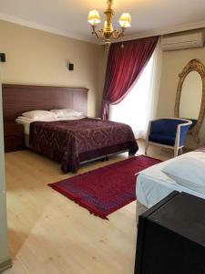 Postel nebo postele na pokoji v ubytování Sehir Apart Hotel