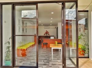an office with sliding glass doors and a table at Maria Cristesa Condotel 