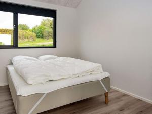 Postel nebo postele na pokoji v ubytování Holiday home Ebeltoft CCV