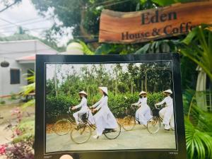 a picture of women in white riding bikes at Eden House & Coffee Con Dao in Con Dao