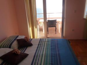 Postel nebo postele na pokoji v ubytování Apartments Jana