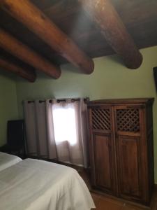 A bed or beds in a room at Hotel Molino Alto