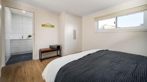 Ένα ή περισσότερα κρεβάτια σε δωμάτιο στο Sunshine Retreat Villa 8