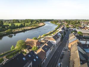 an aerial view of a town with a river at B&B De Noorderwind in Schoonaarde