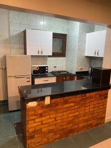 A kitchen or kitchenette at Delta Sharm 205