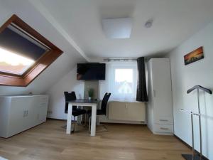 TV a/nebo společenská místnost v ubytování Apartment Q im Zentrum von Königsbronn