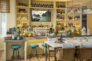 a bar with blue stools in a restaurant at Circa 39 Hotel Miami Beach in Miami Beach