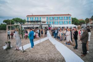 a group of people standing in front of a line at Hôtel George Sand in La Seyne-sur-Mer