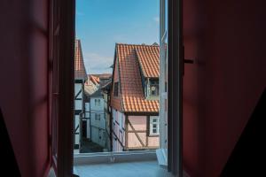 an open window with a view of a city at Apartment Alma in Quedlinburg