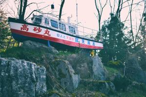 a boat sitting on top of some rocks at Takasago Onsen in Asahikawa