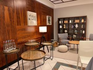 a room with wooden walls and tables and chairs at Hotel Alte Mühle in Bad Bertrich