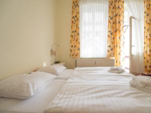 Postel nebo postele na pokoji v ubytování Villa Neptun