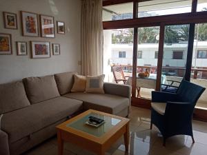 a living room with a couch and a coffee table at Apartamento en Puerto Rico in Puerto Rico de Gran Canaria