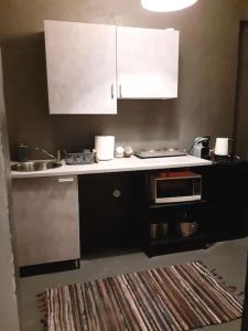Kuchyň nebo kuchyňský kout v ubytování Athens Mets-Central apt