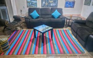 A seating area at Jamila cosy apartment