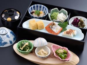 a tray with different types of food in bowls at Gion Fukuzumi in Kyoto