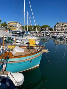 a boat is docked in a harbor with other boats at Een parel aan de Cote 'd Azur ! in Vallauris
