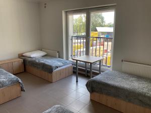 Postel nebo postele na pokoji v ubytování Hostel przy Stadionie