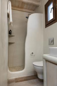 a bathroom with a toilet and a sink at Elizabeth's small apartment in Naxos Chora +18 photos