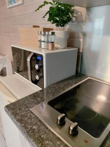 a kitchen with a sink in a counter top at Arolahti Suite ( Rapojärvi ) in Kouvola