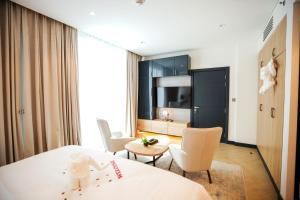 Krevet ili kreveti u jedinici u okviru objekta Royal Mansoura Residence Hotel