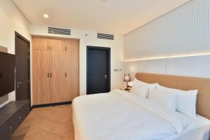 Krevet ili kreveti u jedinici u okviru objekta Royal Mansoura Residence Hotel
