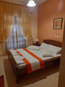 Posteľ alebo postele v izbe v ubytovaní Vassilis Apartments
