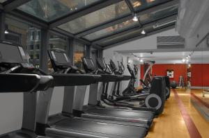 a row of treadmills in a gym at The Manhattan at Times Square in New York