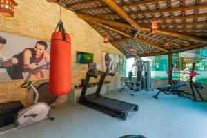 a gym with two tread machines and a punching bag at Apto Joao Pessoa/Cabedelo in Cabedelo