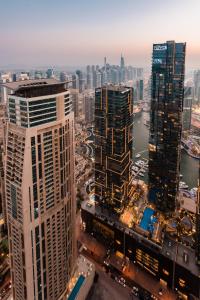 an aerial view of a city with tall buildings at Skyview Host in Dubai