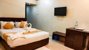 Postel nebo postele na pokoji v ubytování Hotel Sea Cox