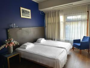 Postel nebo postele na pokoji v ubytování Arkadia Hotel & Hostel