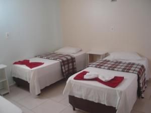 Postel nebo postele na pokoji v ubytování Hotel Alvorada