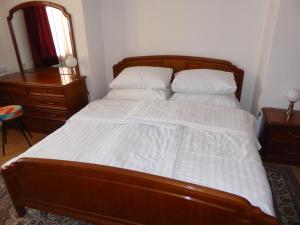 a bed with white sheets and pillows in a bedroom at Sommerfrische Waldviertel in Kirchberg am Walde