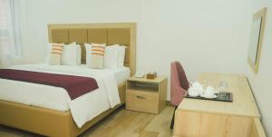 Postel nebo postele na pokoji v ubytování Quest Boutique Hotel