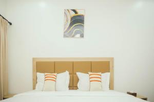 Postel nebo postele na pokoji v ubytování Quest Boutique Hotel