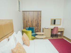 Postel nebo postele na pokoji v ubytování Quest Boutique Hotel