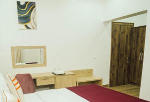 Postel nebo postele na pokoji v ubytování Quest Boutique Hotel