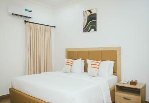 Postel nebo postele na pokoji v ubytování Quest Boutique Hotel