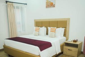 Postel nebo postele na pokoji v ubytování Quest Boutique Hotel