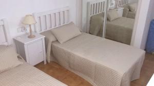 Ένα ή περισσότερα κρεβάτια σε δωμάτιο στο Royal park albatros bonito apartamento Golf del Sur