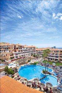 a view of a resort with a swimming pool at Royal park albatros bonito apartamento Golf del Sur in San Miguel de Abona