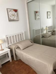Postel nebo postele na pokoji v ubytování Royal park albatros bonito apartamento Golf del Sur